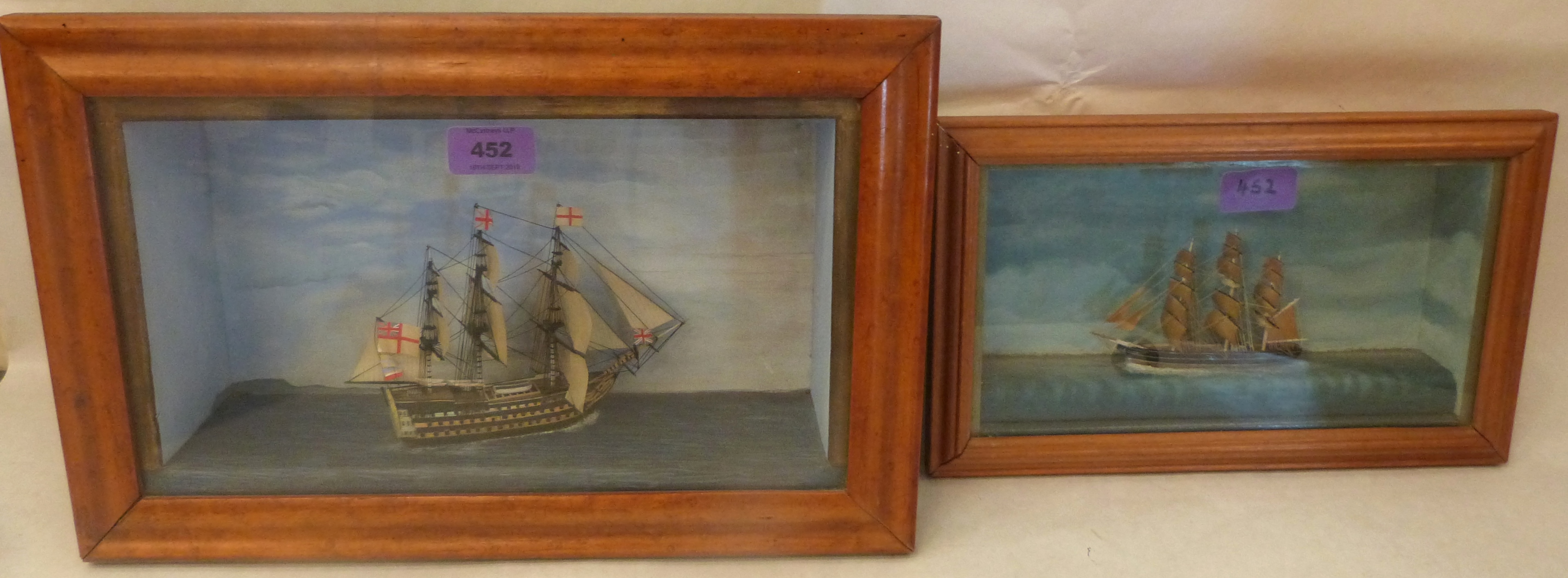 A maple framed marine diorama 15½' wide and a smaller example