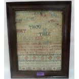 An early George III needlework sampler by Mary Isaac, aged nine 1760, worked with religious and