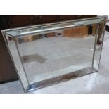 A sectional plate wall mirror. 42' wide