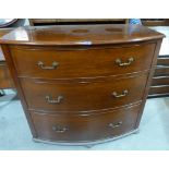 A 19th century mahogany bowfronted chest of three long drawers on bun feet. 48' wide