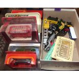 A collection of boxed and unboxed diecast vehicles