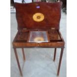 A mahogany and inlaid lady's dressing table, the fitted interior with mirror on ratchet support,