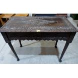 A Victorian oak carved side table on turned legs with pad feet. 39' wide