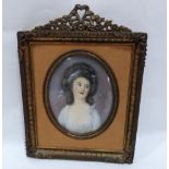 A French portrait miniature of a young lady, she wearing a lace trimmed low cut dress. The gilt