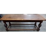 An oak refectory table with demi-lunette carved frieze on bulbous turned legs