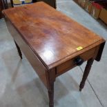 A Victorian mahogany Pembroke table on turned legs. 35' wide