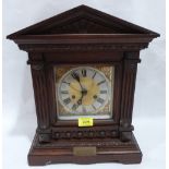 An early 20th century oak mantle clock in architectural case. 16' high