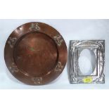 An Arts and Crafts embossed pewter photograph frame 8' high and a planished copper dish. 11¼' diam