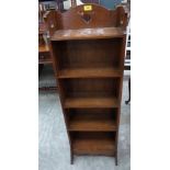 An oak open bookcase of five shelves 46' high