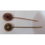 A Victorian yellow metal stickpin set with a bloodstone and another example.