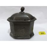 A pewter octagonal tobacco box with engraved armorial. 5½' high