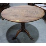 A 19th century oak snap-top tripod table. 32' diam.