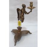 A brass figural angel candlestick on trefoil base. 11' high