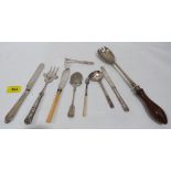 A silver knife and other plated cutlery