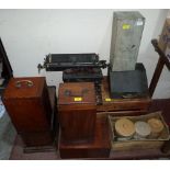 A wooden crate, various boxes, stoneware, two typewriters and a sewing machine