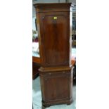 A mahogany standing corner cupboard of recent manufacture