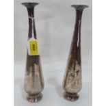 A pair of Islamic white metal bud vases with engraved decoration. 11¼' high