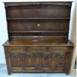 An oak dresser with raised rack. 60' wide