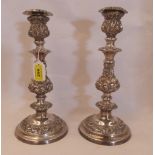 A pair of plated rococo revival candlesticks 12½' high