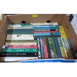 A large collection of books on cricket