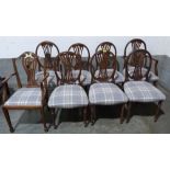 A set of seven Hepplewhite style dining chairs and another carver chair