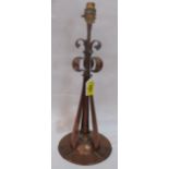 An Arts and Crafts planished and wrought copper lamp base in the manner of Liberty & Co 14½' high