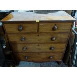 A late George III mahogany chest, the flame veneered top with reeded edge over two short and three