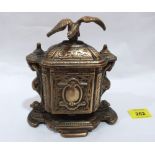 A cast brass tobacco box. 6½' high