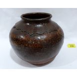 A Chinese earthenware vessel, decorated in mottled brown glaze. 8' diam