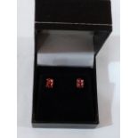 A pair of 9ct orange tourmaline stud earrings. 1.3g