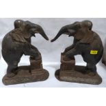 A pair of 19th century Indian carved wood elephants. 16' high. Damage, losses