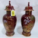 A pair of Carlton Ware inverted baluster vases with domed covers, painted in colours with