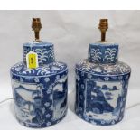 A pair of Chinese blue and white table lamps painted in reserves with landscapes