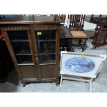 An oak glazed bookcase and a folding occasional table