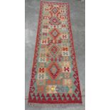 A wool vegetable dyed Choli Kelim runner. 200cm x 60cm