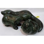A bronze group of three otters. Signed A.M. ac. 14' wide