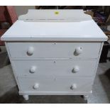 A Victorian painted pine chest of three long drawers on turned feet