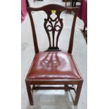 A 19th century dining chair with pierced splat on moulded chamfered legs