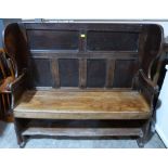 An 18th century joined oak wing back country settle with six panel fielded back. 53' wide