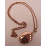 A gold seed pearl locket on necklet chain marked 375. 27.5g