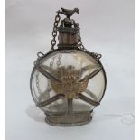An East European white metal mounted glass pilgrim flask, applied to both faces with a gilt double