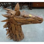 A wood construction assemblage of a horse's head. 36' high