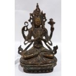 An oriental bronze figure of a seated deity. 5¾' high