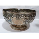 Paul Storr. 1770-1844. A George III silver table bowl with repousse chased decoration of scrolling