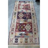 A Kilim rug. 74' x 34'