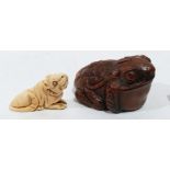 A Japanese carved boxwood toad netsuke and another carved as a rat in ivory