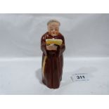A Royal Worcester monk candle snuffer. 5' high