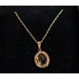 A 9ct cabochon stone set pendant on necklet chain