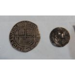 An Elizabeth I silver shilling and an Elizabeth I silver threepence. Both very worn.