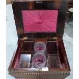 A George IV rosewood teapoy, the interior fitted with four caddies and two glass mixing bowls, on
